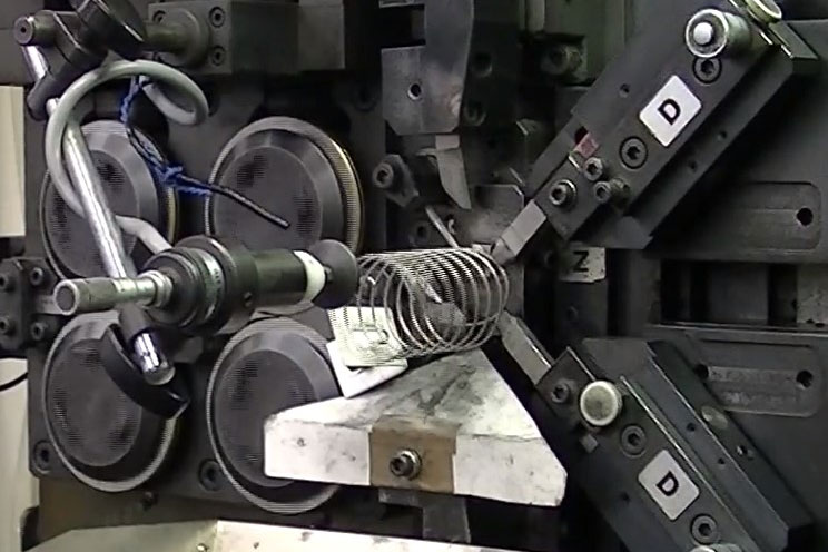 圧縮コイルばね機械